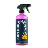 Eine rosa Sprühflasche mit dem Produkt Waschen und Versiegeln – Ready to Use von KOM Duschen GmbH, versehen mit einem Etikett, auf dem eine Gummiente mit Fahrradhelm abgebildet ist.